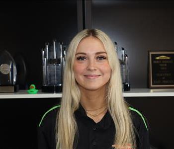 Professional headshot of Chloe Wolfswinkel, Social Media and Local Marketing Specialist at SERVPRO of Phoenix, smiling in SER