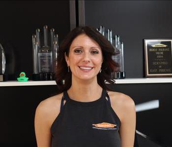 Professional headshot of Nicole Baird, General Manager of SERVPRO of Phoenix, smiling in a branded SERVPRO Shirt.
