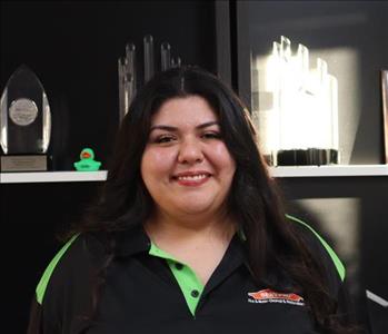 Cece Macias, Job File Coordinator at SERVPRO of Phoenix, organizing restoration documentation in the office.
