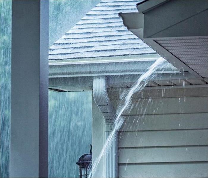 water pouring off roof during a Phoenix monsoon