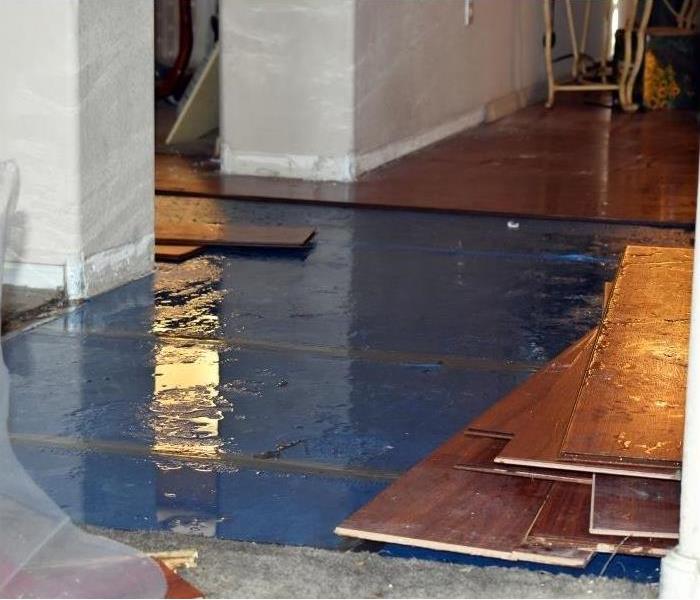 Damaged flooring after a storm in Phoenix